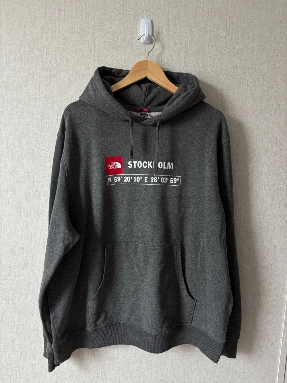 The North Face Men’s Stockholm Hoodie in Charcoal Gray with Red Logo